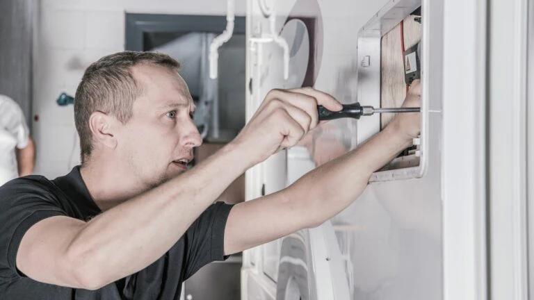 A man doing maintenance on his RV