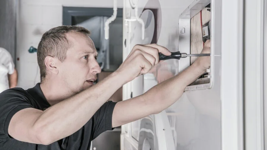 A man doing maintenance on his RV