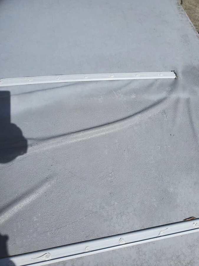 rv roof damage showing wrinkles due to rv roof bubbles